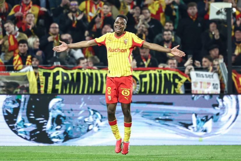 Lens' Malian midfielder #08 Mamadou Sangare celebrates scoring his team's third goal during the French L1 football match between RC Lens and SCO Angers at the Stade Bollaert-Delelis in Lens, northern France, on March 20, 2026.  Sameer Al-DOUMY / AFP
