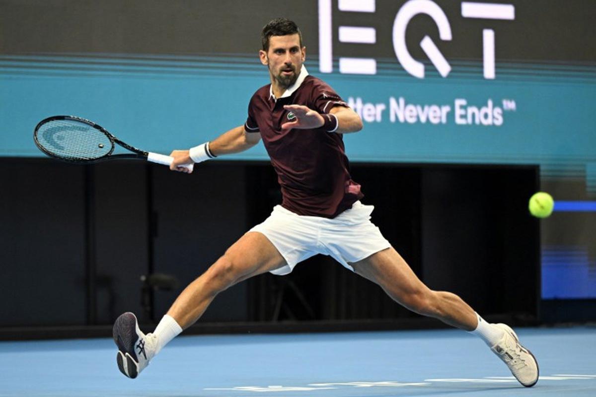 Serbia's Novak Djokovic hits a return to Australia's Alex de Minaur during the men's singles final at the China Open tennis tournament in Beijing on October 6, 2026.  Greg Baker / AFP