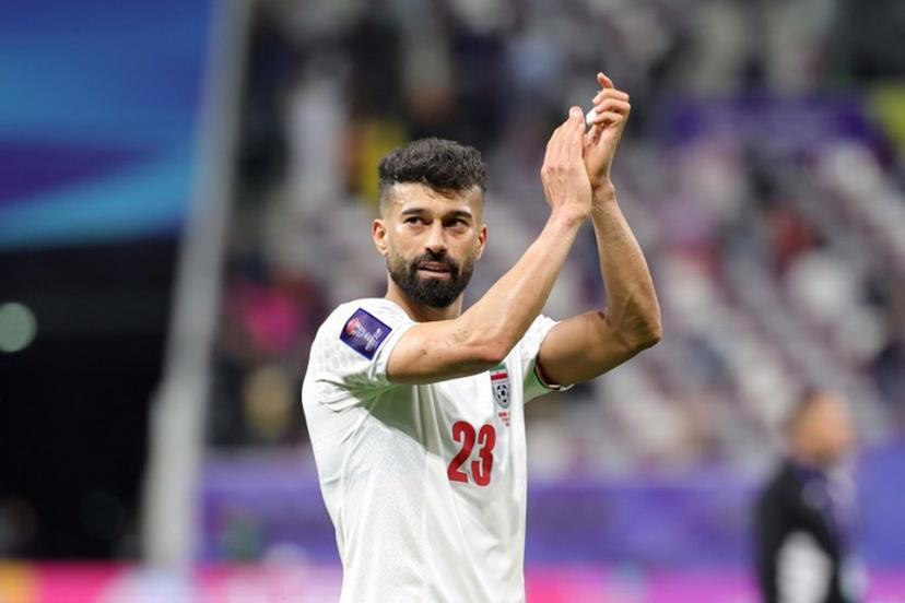Iran's defender #23 Ramin Rezaeian reacts after the Qatar 2023 AFC Asian Cup Group C football match between Hong Kong and Iran at the Khalifa International Stadium in Doha on January 19, 2024.  Giuseppe CACACE / AFP