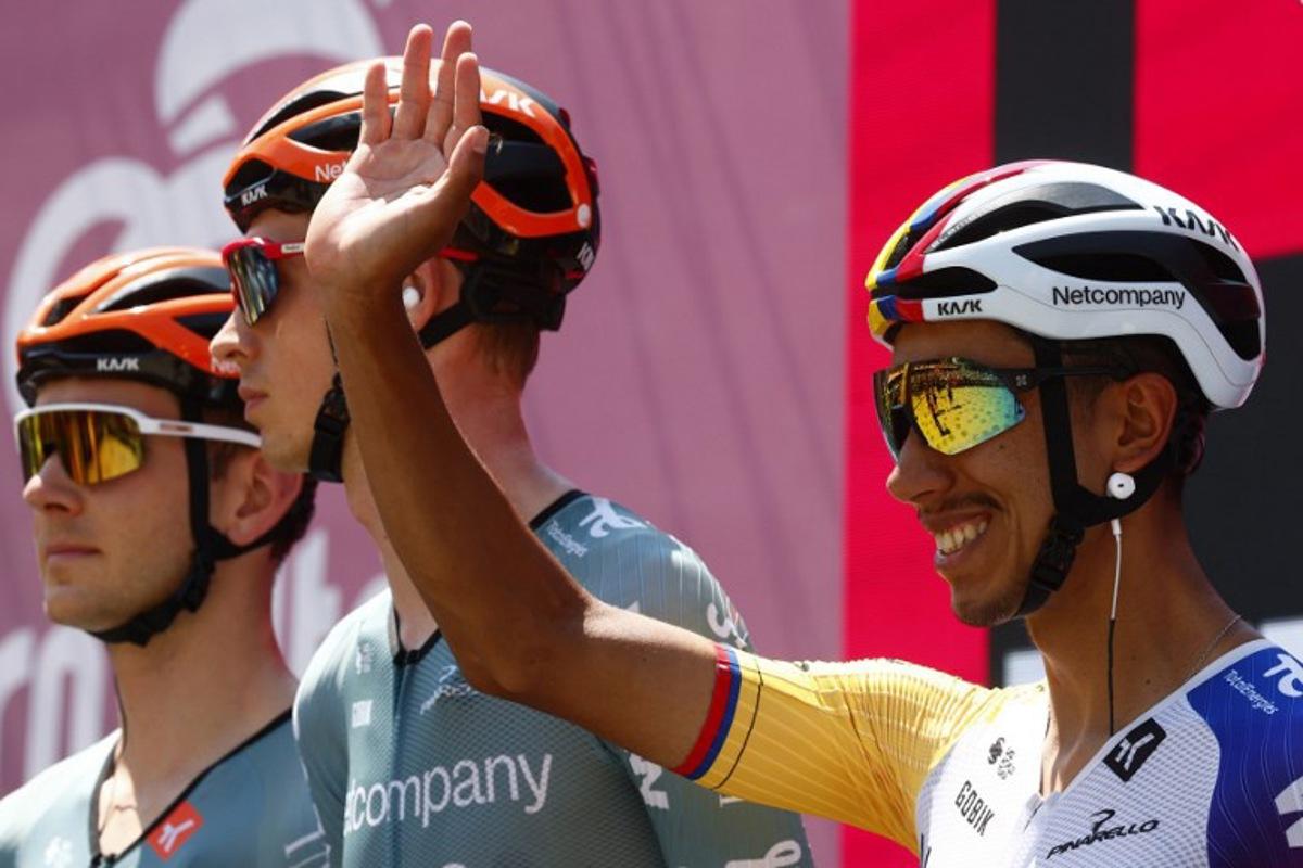 INEOS Grenadiers Colombian rider Egan Bernal (R) waves on stage prior the 16th stage of the Giro d'Italia 2026 - Tour of Italy cycling race between Bellinzona and Cari, Switzerland, on May 26, 2026.  Luca Bettini / AFP
