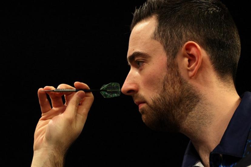 England's Luke Humphries competes during his quarter-final darts match against England's Luke Littler on Night 1 of the PDC Premier League, at the Utilita Arena in Cardiff, south Wales on February 1, 2024.  Adrian DENNIS / AFP