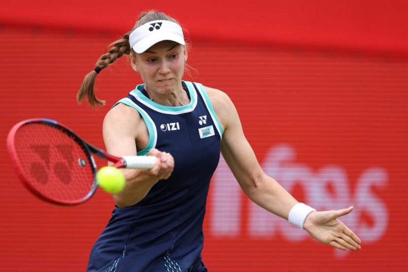 Kazakhstan's Elena Rybakina returns the ball during her round of 16 women's singles match against Germany's Tatjana Maria at the HSBC WTA tennis Championships at Queen's Club in west London on June 12, 2026.  Adrian Dennis / AFP