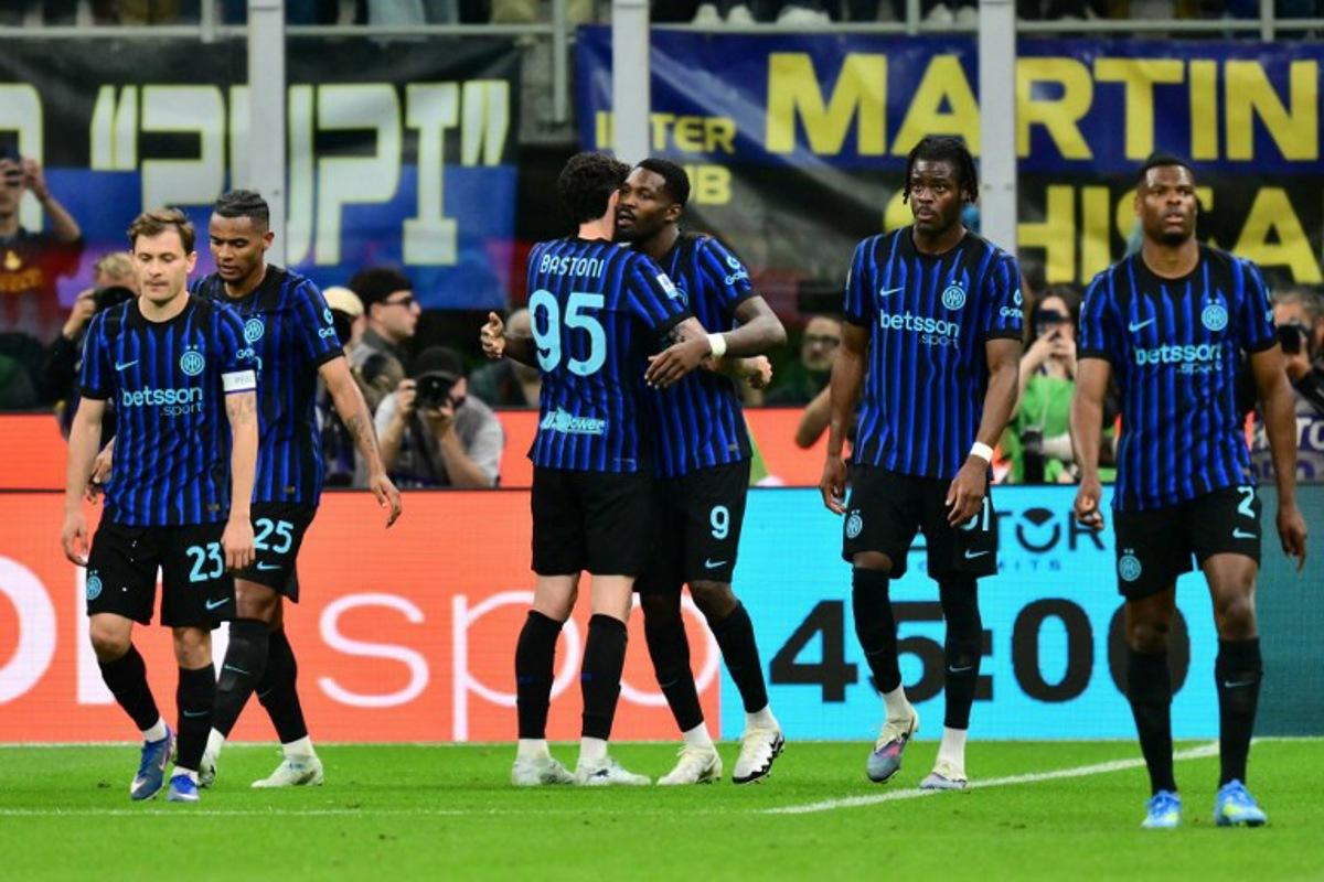 Inter Milan's French forward #9 Marcus Thuram celebrates scoring his team's first goal with Inter Milan's Italian defender #95 Alessandro Bastoni during the Italian Serie A football match between Inter Milan and Parma at San Siro stadium in Milan, on May 3, 2026.  Stefano RELLANDINI / AFP