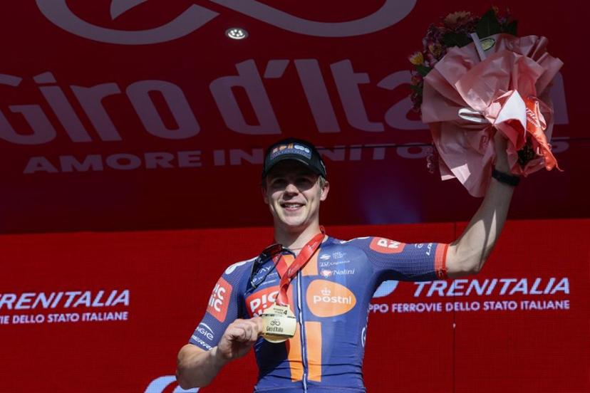 Team Picnic PostNL's Dutch rider Casper Van Uden celebrates on the podium after winning the 4th stage of the 108th Giro d'Italia cycling race 189kms from Alberobello to Lecce on May 13, 2025.  Luca Bettini / AFP