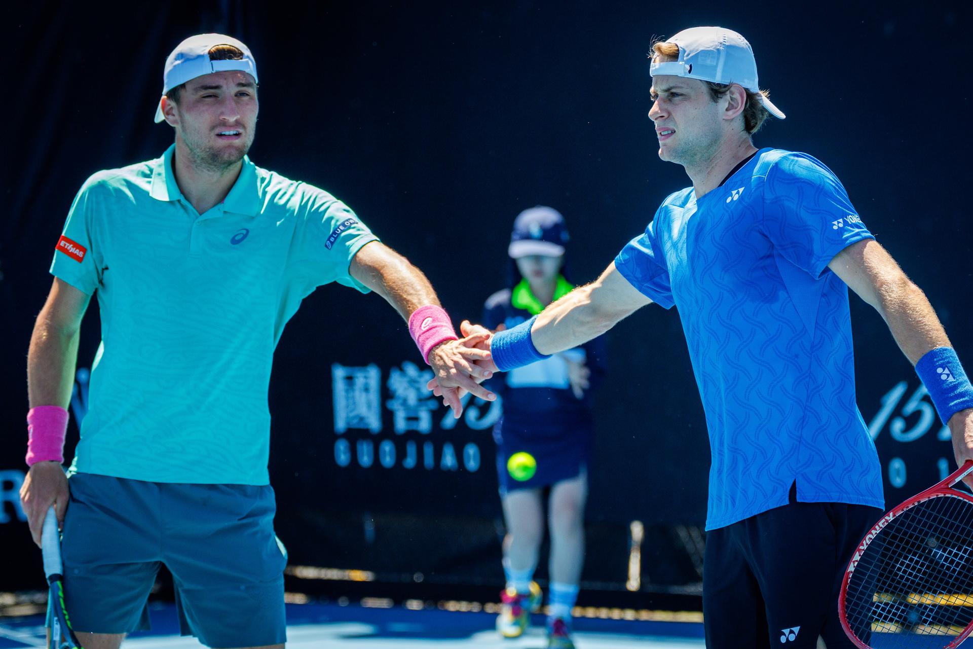 Belgian Raphael Collignon, Belgian Zizou Bergs and pictured during a first round match of Belgium's Bergs/Collignon against Australia's pair McCabe/Tu in the men doubles at the Australian Open, Melbourne Park, Melbourne on Wednesday 21 January 2026. McCabe/Tu won the game. BELGA PHOTO PATRICK HAMILTON  --- BENELUX ONLY   ---