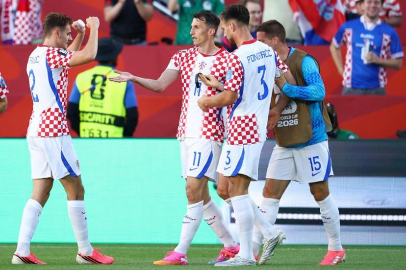 Croatia's forward #11 Ante Budimir celebrates with teammates scoring his team's first goal during the 2026 World Cup Group L football match between Panama and Croatia at the Toronto Stadium in Toronto on June 23, 2026.   Cole Burston / AFP