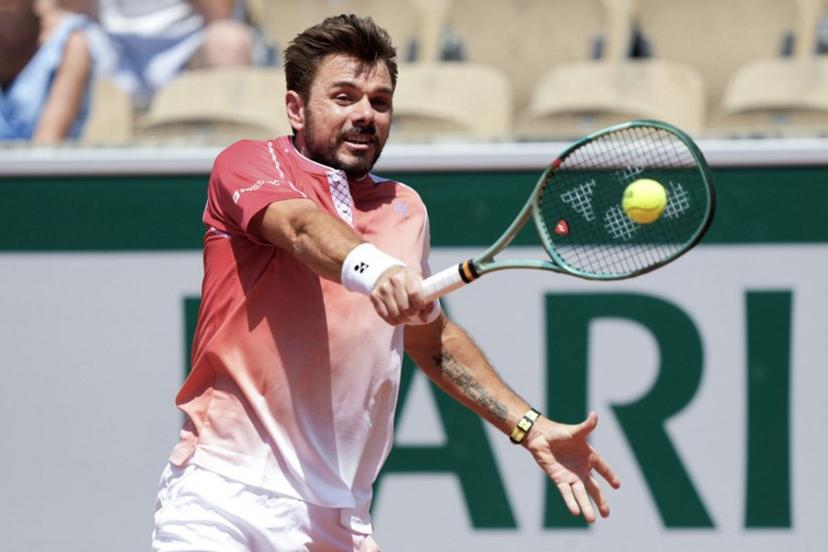 Switzerland's Stan Wawrinka plays a backhand return to Netherlands' Jesper De Jong during their men's singles match on day 2 of the French Open tennis tournament on Court Simonne-Mathieu at the Roland-Garros Complex in Paris on May 25, 2026.  Dimitar DILKOFF / AFP