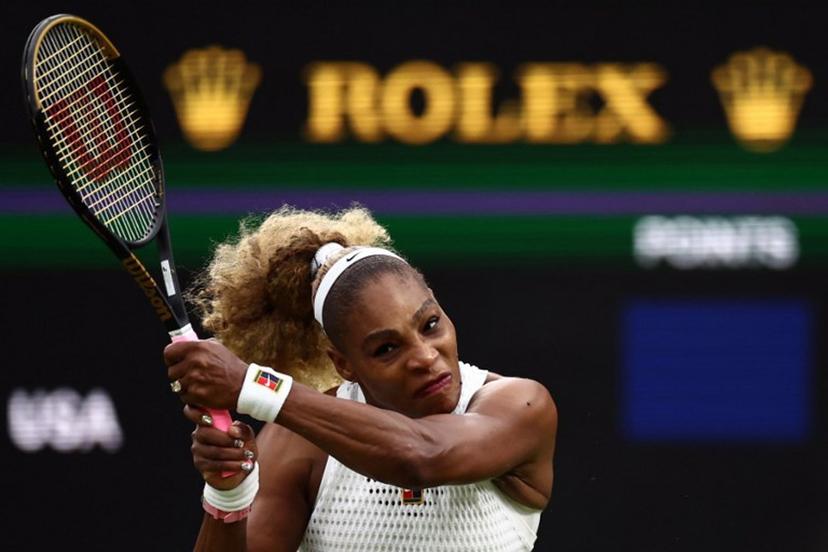 US player Serena Williams returns the ball to Australia's Maya Joint during their women's singles first round tennis match on the second day of the 2026 Wimbledon Championships at The All England Lawn Tennis and Croquet Club in Wimbledon, southwest London, on June 30, 2026.  HENRY NICHOLLS / AFP
