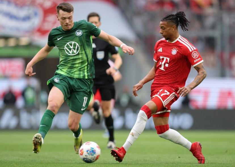 Bayern Munich's French midfielder #17 Michael Olise (R) and Wolfsburg's German forward #17 Dzenan Pejcinovic vie for the ball during the German first division Bundesliga football match between VfL Wolfsburg and FC Bayern Munich in Wolfsburg, on May 9, 2026.  Ronny HARTMANN / AFP