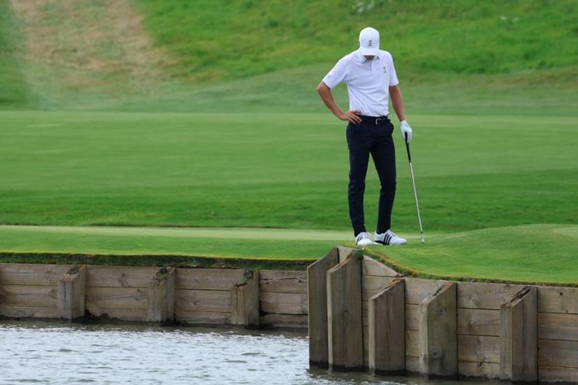 Belgium's Adrien Dumont de Chassart looks on after his ball fell in the water in round 3 of the men's golf individual stroke play of the Paris 2024 Olympic Games at Le Golf National in Guyancourt, south-west of Paris on August 3, 2024.   Emmanuel DUNAND / AFP