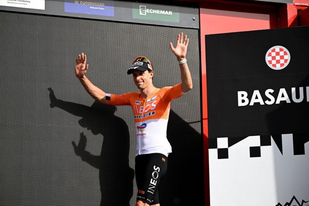 Team Ineos' French rider Axel Laurance celebrates on the podium winning the third stage ahead of Team UAE's Spanish rider Igor Arrieta during the Basque Country's Itzulia cycling tour, a 152.8 km race starting and finishing in Basauri, on April 8, 2026.   ANDER GILLENEA / AFP