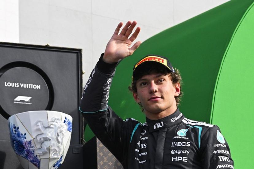 P2 Mercedes' Italian driver Kimi Antonelli celebrates on the podium after the Formula One Dutch Grand Prix at The Circuit Zandvoort, western Netherlands, on August 23, 2026.  JOHN THYS / AFP