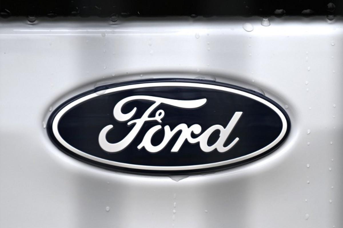 The logo of US car giant Ford is pictured on a car at  a carseller in Gelsenkirchen, western Germany, on November 22, 2024.  Ford on November 20, 2024 announced 4,000 more job cuts in Europe, mostly in Germany and Britain, in the latest blow to the continent's beleaguered car industry. Ina FASSBENDER / AFP