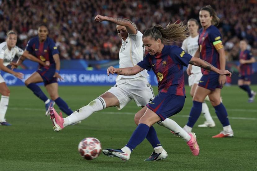 Barcelona's Spanish forward #09 Claudia Pina (R) shoots challenged by Real Madrid's Spanish defender #15 Sheila Garcia during the UEFA Women's Champions League quarter final second leg football match between FC Barcelona and Real Madrid CF at the Camp Nou stadium in Barcelona on April 2, 2026.  Lluis GENE / AFP