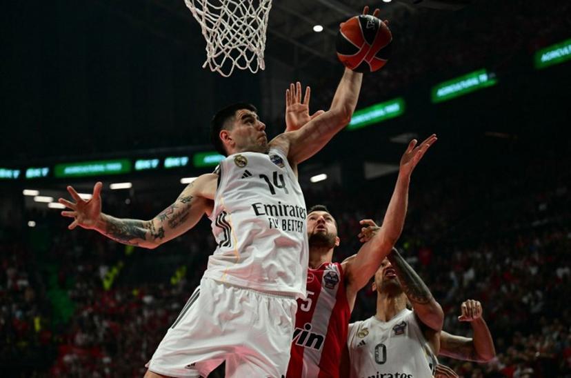 Real Madrid's Argentinian forward #14 Gabriel Deck jumps for the ball during the men's EuroLeague final basketball match between Olympiacos Piraeus and Real Madrid at the Telekom Center Athens in Athens on May 24, 2026.   Angelos Tzortzinis / AFP