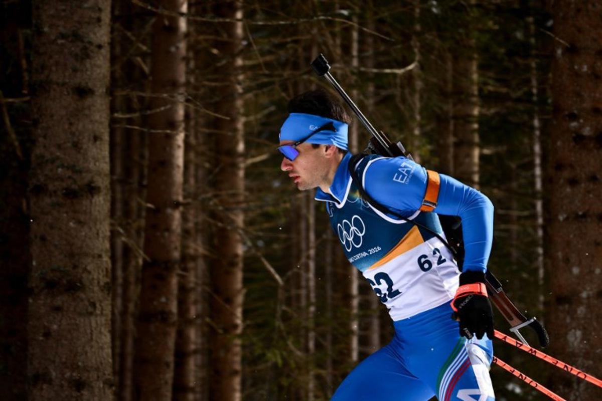 Italy's Tommaso Giacomel competes in the men's biathlon 10km sprint event during the Milano Cortina 2026 Winter Olympic Games at the Anterselva Biathlon Arena (Sudtirol Arena) in Anterselva (Val Pusteria) on February 13, 2026.  Marco BERTORELLO / AFP