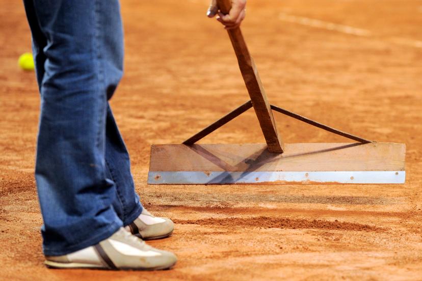 20090915 - CHARLEROI, BELGIUM: Illustration picture shows a man repairing the gravel court, Tuesday 15 September 2009, in Charleroi. The Ukrainian Team made some remarks on the state of the tennis court. Belgium will play against Ukraine in the world group play offs from 18 till 20 September 2009 in Charleroi.  BELGA PHOTO DIRK WAEM