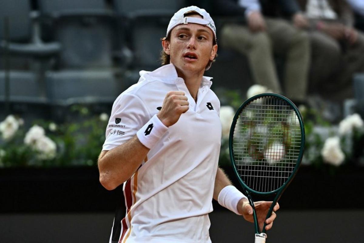 Peru's Ignacio Buse reacts after a point as he plays against to Italy's Lorenzo Sonego during their men's singles match of the WTA Rome Open tennis tournament at the Foro Italico in Rome on May 7, 2026.   Filippo MONTEFORTE / AFP