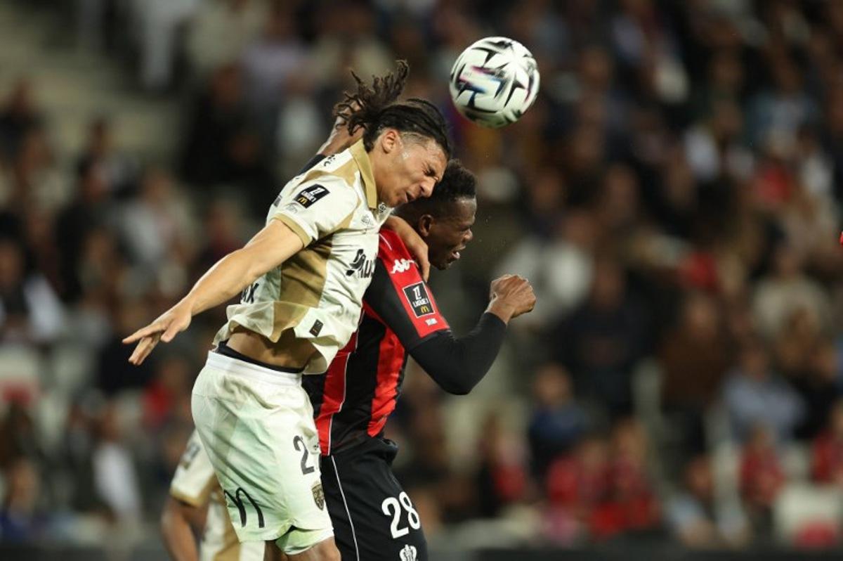 Lens' French defender Pierre Ismaelo Ganiou (L) fights for the ball with Nice's Sierra Leonean defender #28 Juma Bah (R) during the French L1 football match between OGC Nice and RC Lens at the Allianz Riviera Stadium in Nice on May 2, 2026.  Valery HACHE / AFP