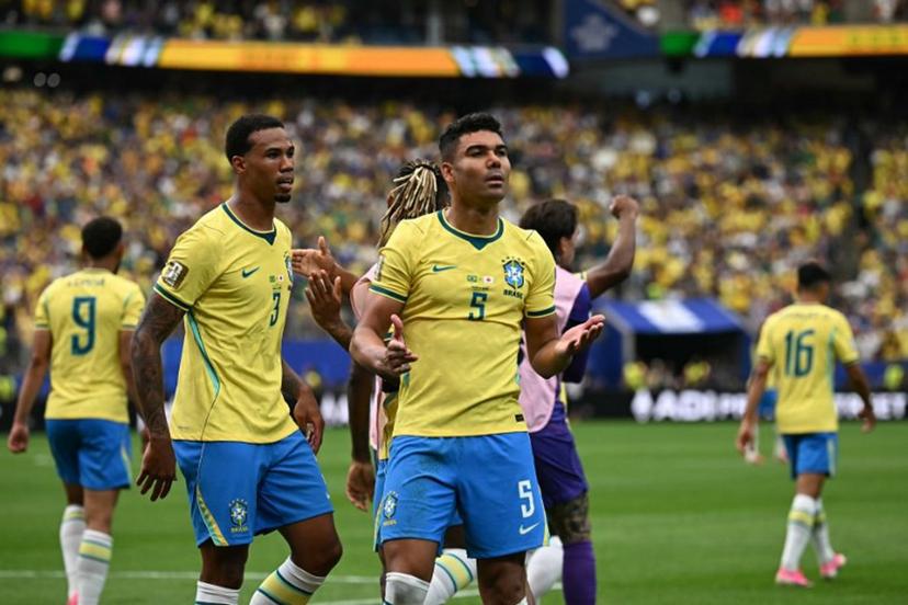 Brazil's midfielder #05 Casemiro (C) celebrates after scoring his team's first goal during the 2026 World Cup round of 32 football match between Brazil and Japan at the Houston Stadium in Houston on June 29, 2026.   Paul ELLIS / AFP