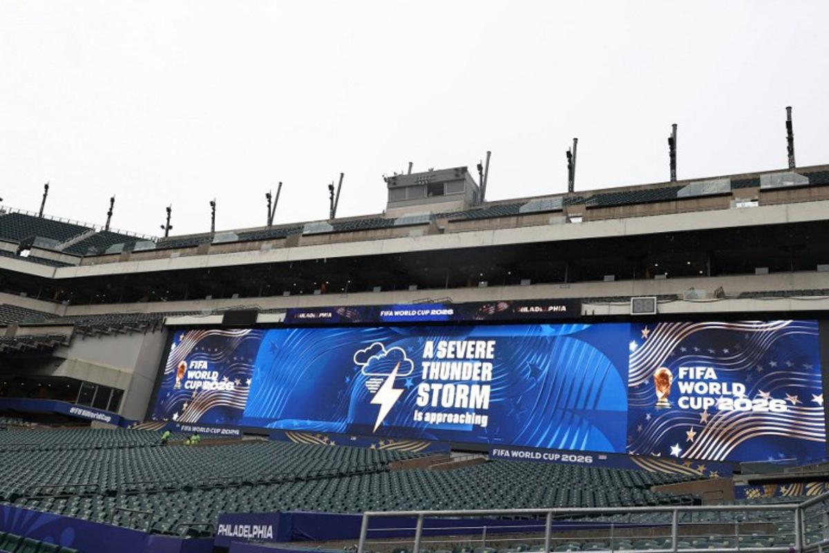A jumbotron informs about a thunderstorm approaching ahead of the 2026 World Cup Group I football match between France and Iraq at the Philadelphia Stadium in Philadelphia on June 22, 2026.   FRANCK FIFE / AFP