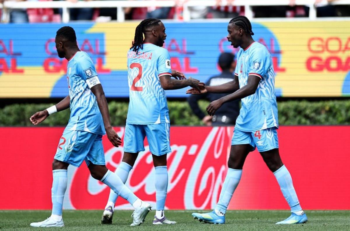 DR Congo's defender #04 Axel Tuanzebe (R) celebrates with teammate defender #02 Aaron Wan-Bissaka after scoring a goal in extra time during the 2026 FIFA World Cup qualifiers final playoff football match between the Democratic Republic of the Congo and Jamaica at the Akron Stadium in Zapopan, Jalisco state, Mexico, on March 31, 2026.  Ulises Ruiz / AFP