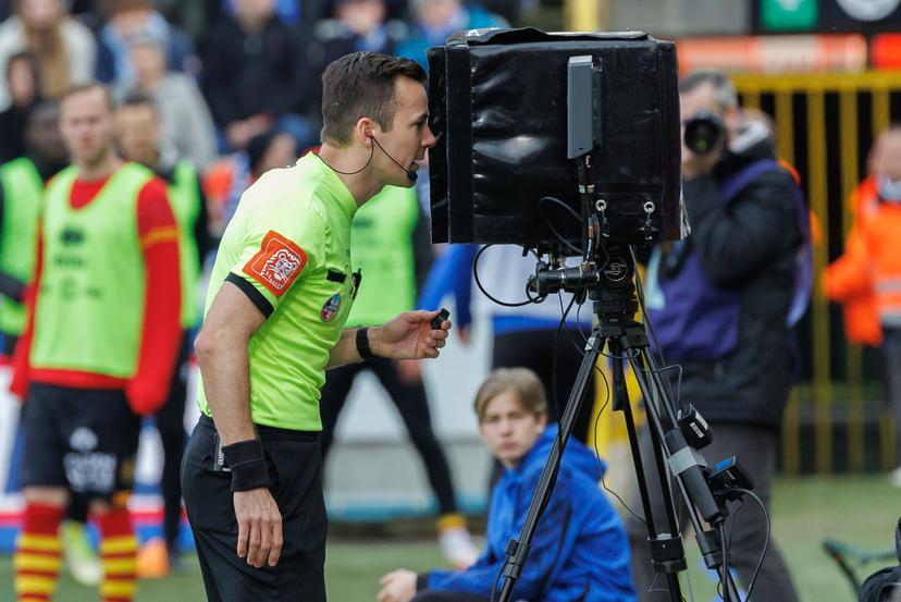 referee Bram Van Driessche pictured watching a scene on the VAR video assistant referee screen during a soccer match between Club Brugge KV and KV Mechelen, Sunday 10 April 2022 in Brugge, on day 34 of the 2021-2022 'Jupiler Pro League' first division of the Belgian championship. BELGA PHOTO KURT DESPLENTER