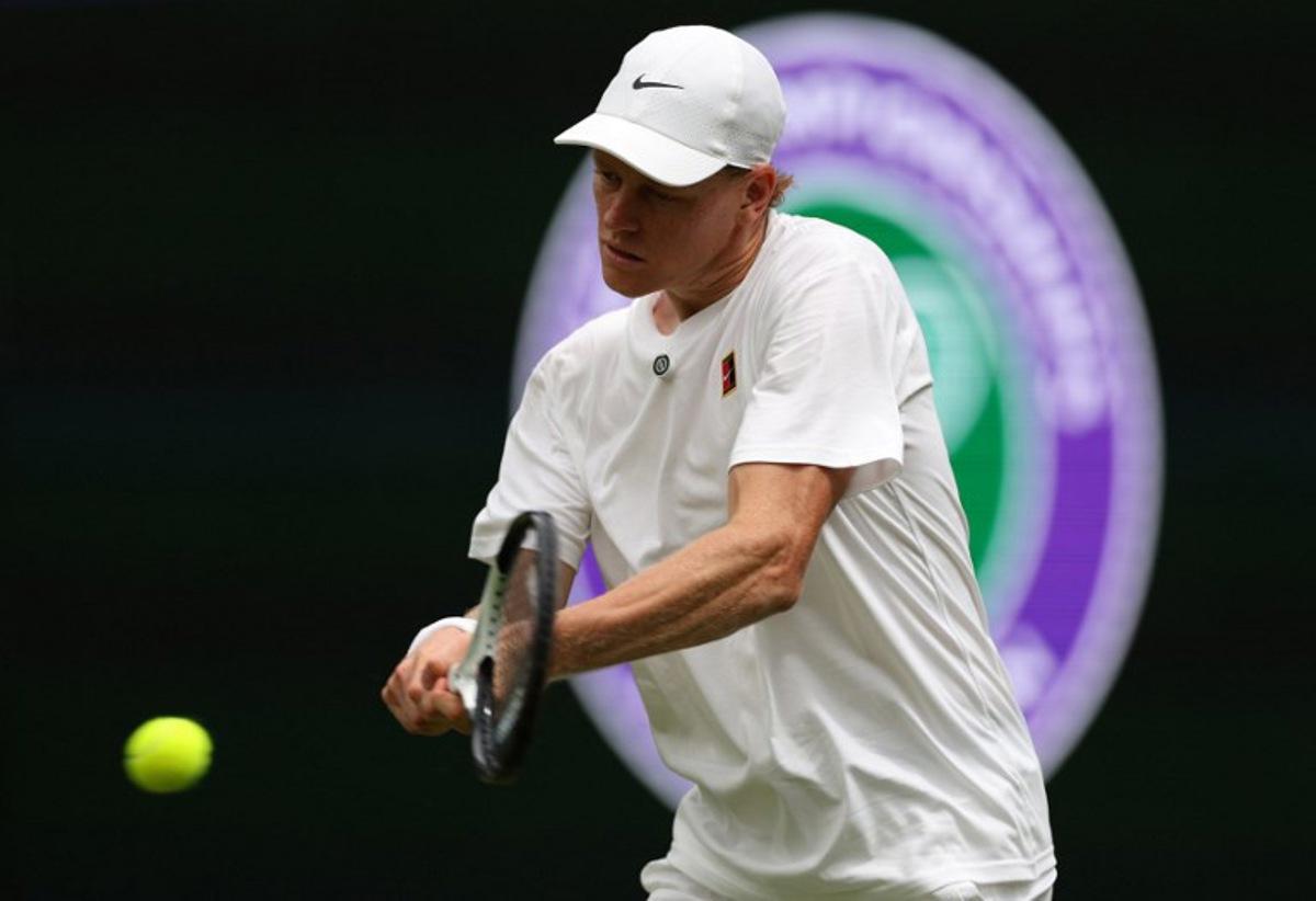 Italy's Jannik Sinner practices with Serbia's Novak Djokovic on No. 1 Court at The All England Lawn Tennis and Croquet Club in Wimbledon, southwest London, on June 25, 2026, ahead of the 2026 Wimbledon Championships.  Adrian Dennis / AFP