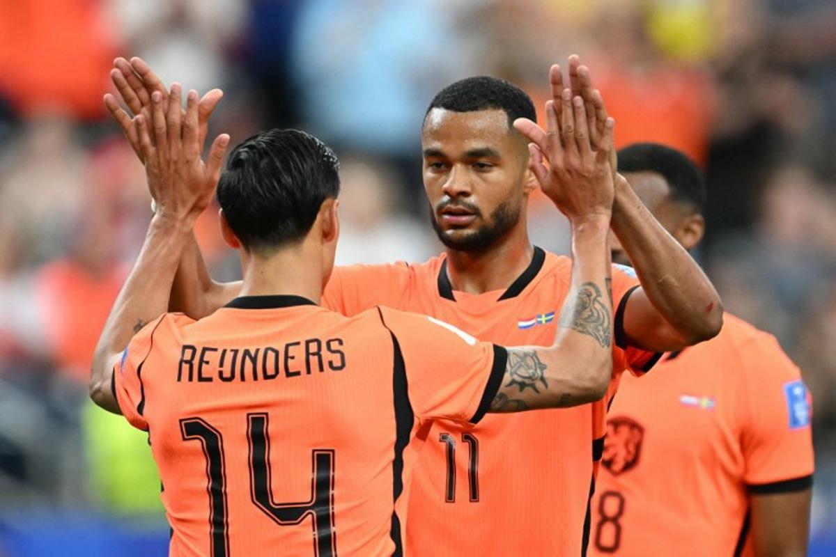Netherlands' forward #11 Cody Gakpo celebrates scoring this team's fourth goal during the 2026 World Cup Group F football match between the Netherlands and Sweden at the Houston Stadium in Houston on June 20, 2026.   RONALDO SCHEMIDT / AFP