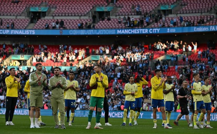 Southampton's players applaud fans on the pitch after the English FA Cup semi final football match between Manchester City and Southampton at Wembley stadium in London, on April 25, 2026. City won the game 2-1 Ben STANSALL / AFP