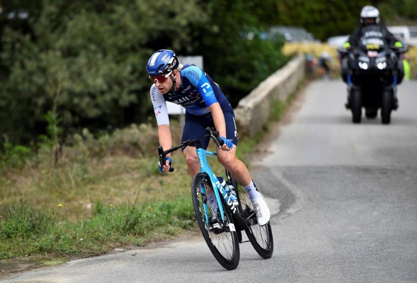 Team Israel Premier Tech 's Riley Sheehan escapes from the pack during the stage 18 of the Vuelta a Espana, a 179,5 km race between Vitoria-Gasteiz and Maeztu, on September 5, 2024.    ANDER GILLENEA / AFP