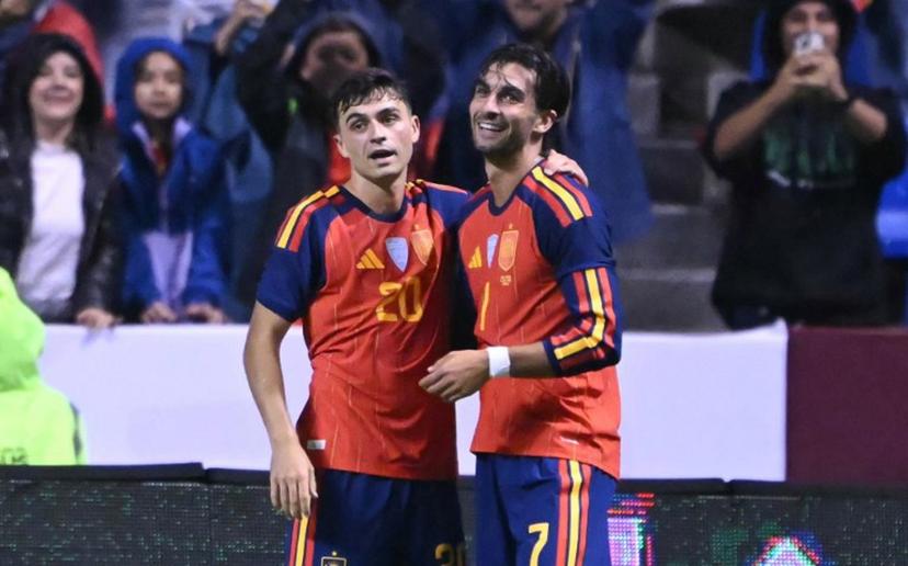 Spain's midfielder #20 Pedri celebrates with Spain's forward #07 Ferran Torres after scoring his team's second goal during the international friendly football match between Peru and Spain at Cuauhtemoc Stadium in Puebla, Mexico, on June 8, 2026.  CARL DE SOUZA / AFP