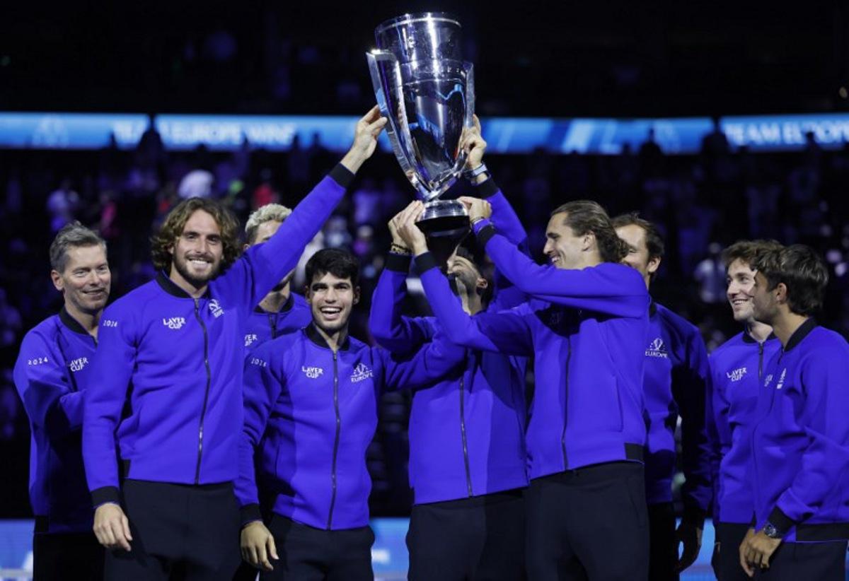 Greece's Stefanos Tsitsipas (2L), Spain's Carlos Alcaraz (3L), Germany's Alexander Zverev (4R) and other players of Team Europe celebrate with the trophy during the awarding ceremony at the end of the 2024 Laver Cup tennis tournament in Berlin, Germany on September 22, 2024. Spain's Carlos Alcaraz won the last match of the tournament 6-2, 7-5 against USA's Taylor Fritz of Team World. Team Europe won 13-11 against Team World.  Odd ANDERSEN / AFP