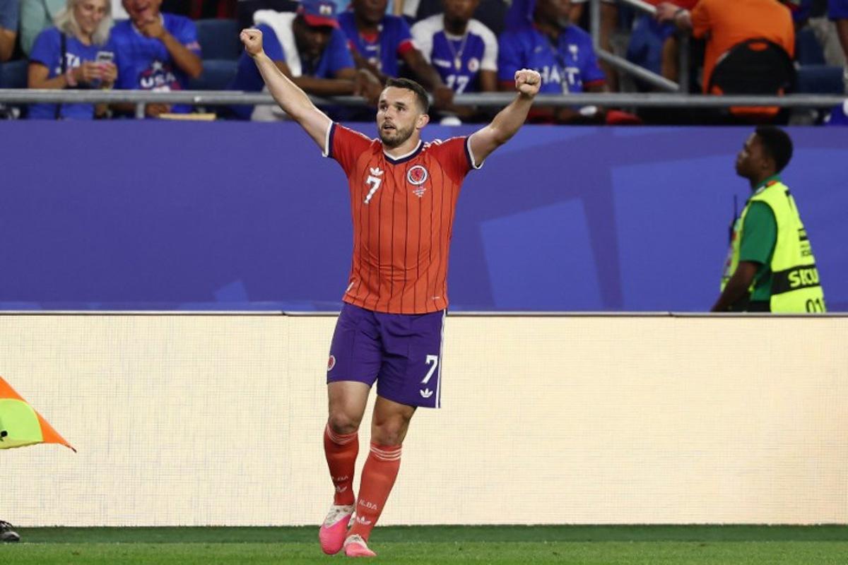 Scotland's midfielder #07 John McGinn celebrates after scoring his team's first goal during the 2026 World Cup Group C football match between Haiti and Scotland at the Boston Stadium in Foxborough on June 13, 2026.  FRANCK FIFE / AFP