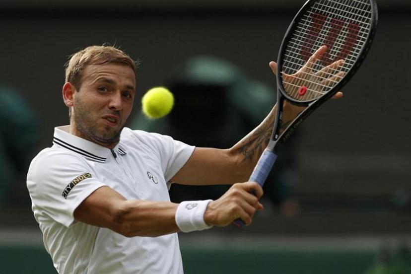 Britain's Dan Evans returns to US player Sebastian Korda during their men's singles third round match on the fifth day of the 2021 Wimbledon Championships at The All England Tennis Club in Wimbledon, southwest London, on July 2, 2021.  Adrian DENNIS / AFP RESTRICTED TO EDITORIAL USE

