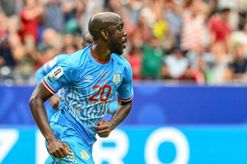 Congo DR's forward #20 Yoane Wissa (L) celebrates after scoring his team's first goal during the 2026 World Cup Group K football match between Portugal and the Democratic Republic of Congo at the Houston Stadium in Houston on June 17, 2026.   RONALDO SCHEMIDT / AFP