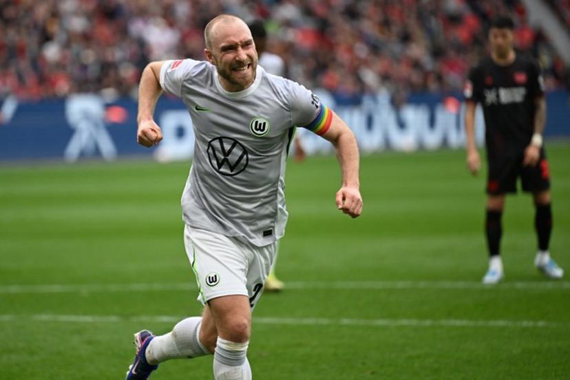 Wolfsburg's Danish midfielder #24 Christian Eriksen celebrates scoring a penalty during the German first division Bundesliga football match between Bayer leverkusen and VfL Wolfsburg in Leverkusen on April 4, 2026.  INA FASSBENDER / AFP