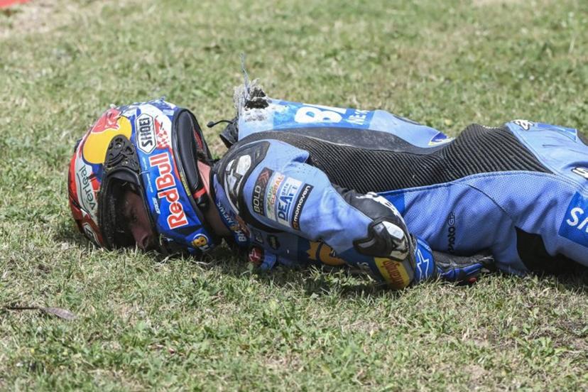 Team Gresini Racing MotoGP's Alex Marquez lies on the side of the track after crashing at high speed during the 2026 Catalunya Moto GP Grand Prix at the Catalunya racetrack in Montmelo, near Barcelona, on May 17, 2026.  JOSE JORDAN / AFP