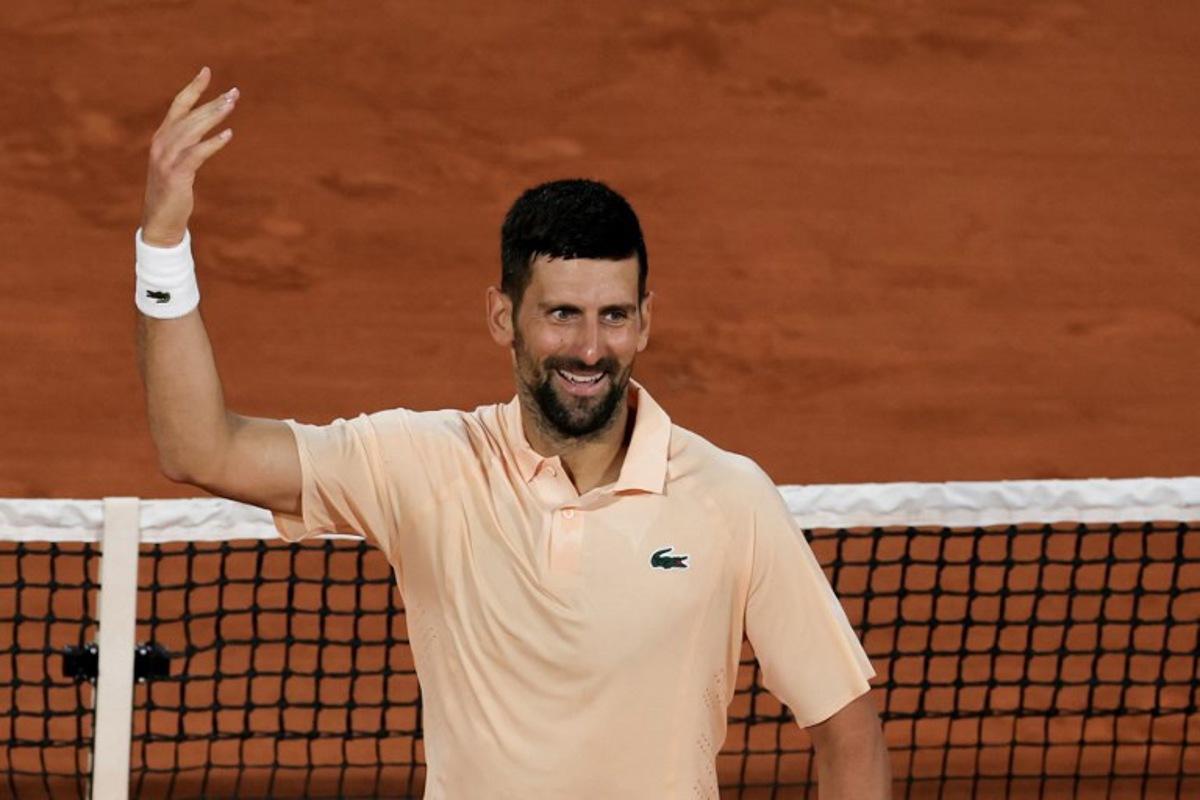 Serbia's Novak Djokovic celebrates after winning the second set as he plays against France's Giovanni Mpetshi Perricard during their men's singles match on day 1 of the French Open tennis tournament on Court Philippe-Chatrier at the Roland-Garros Complex in Paris on May 24, 2026.  Thomas SAMSON / AFP