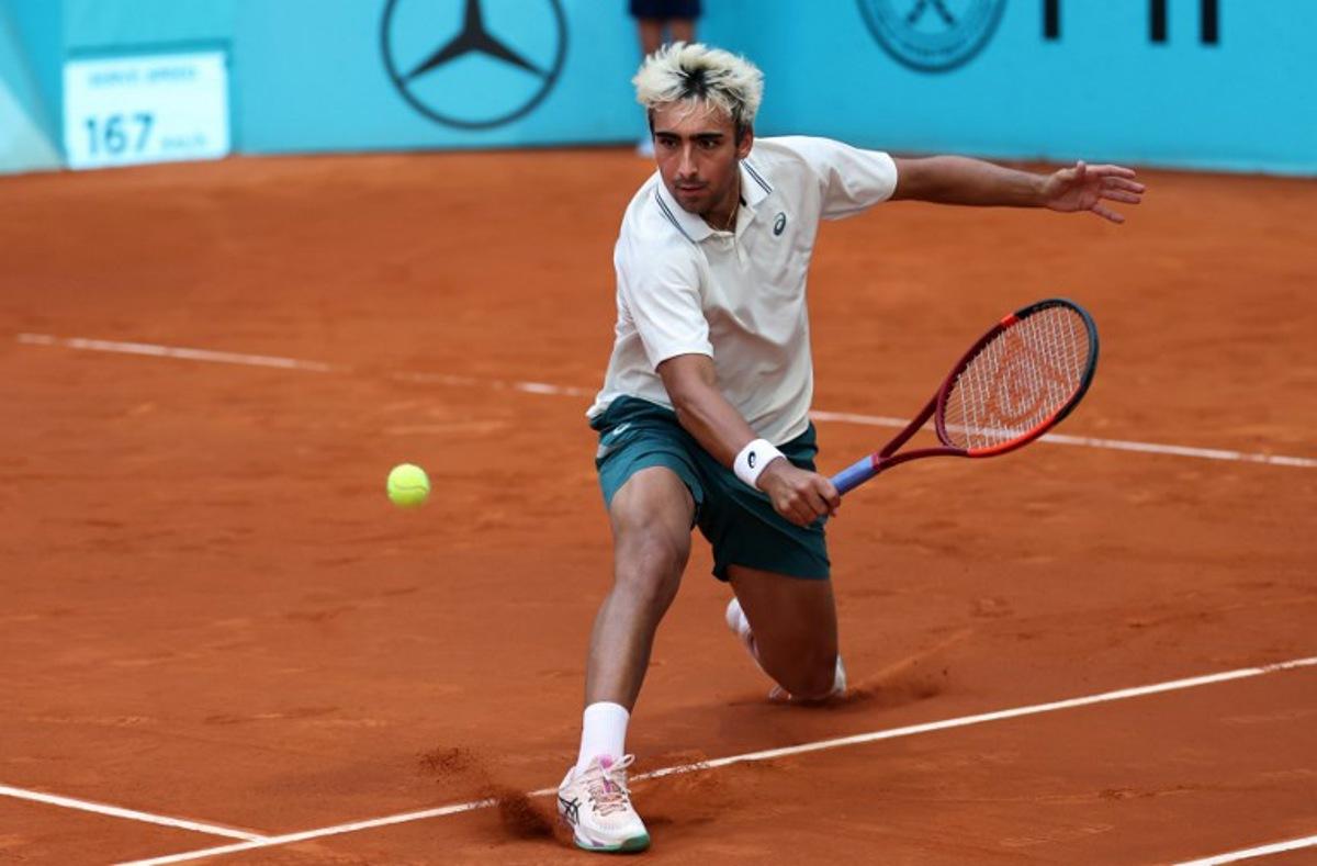 Spain's Daniel Merida returns the ball to France's Corentin Moutet during their 2026 ATP Tour Madrid Open tennis tournament third round singles match at the Caja Magica in Madrid, on April 25, 2026.   Thomas COEX / AFP