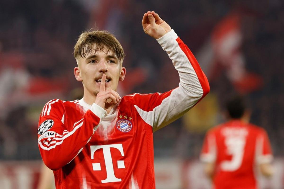 Bayern Munich's German midfielder #42 Lennart Karl celebrates scoring the 3-0 goal with his teammates during the UEFA Champions League, Round of 16 2nd-leg football match between FC Bayern Munich and Atalanta in Munich, southern Germany, on March 18, 2026.  Alexandra BEIER / AFP
