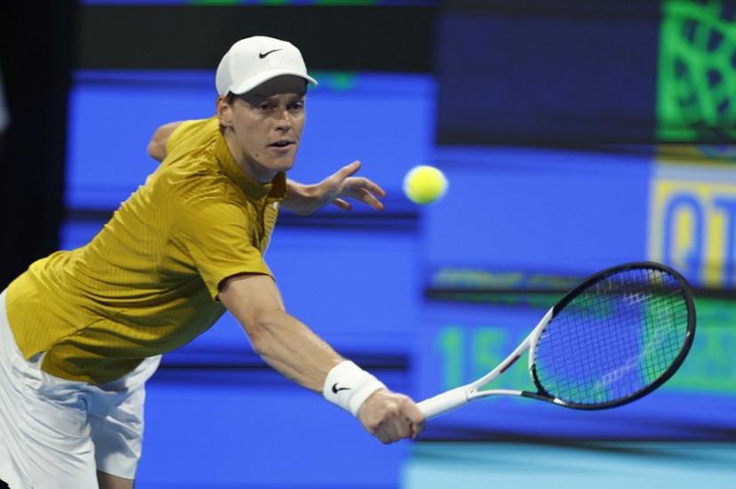 Italy's Jannik Sinner hits a return against Czech Republic's Jakub Mensik during their men's singles quarterfinal match at the Qatar Open tennis tournament in Doha on February 19, 2026.  Karim JAAFAR / AFP