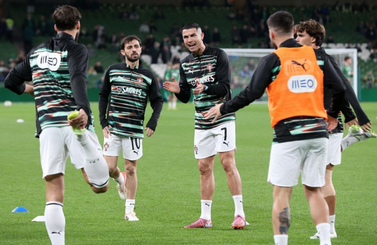Portugal's forward Cristiano Ronaldo warms up ahead of during the men's football 2026 World Cup Group F qualifier between Ireland and Portugal at Aviva Stadium in Dublin on November 13, 2025.  Paul Faith / AFP