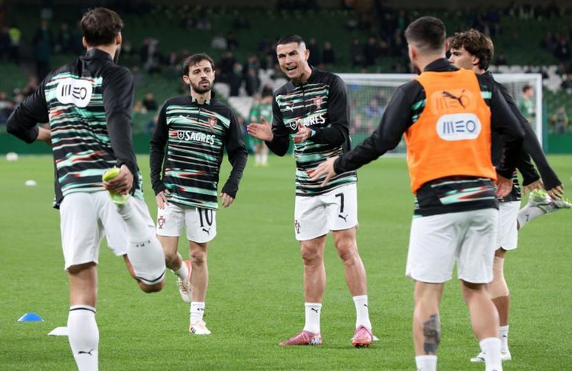 Portugal's forward Cristiano Ronaldo warms up ahead of during the men's football 2026 World Cup Group F qualifier between Ireland and Portugal at Aviva Stadium in Dublin on November 13, 2025.  Paul Faith / AFP