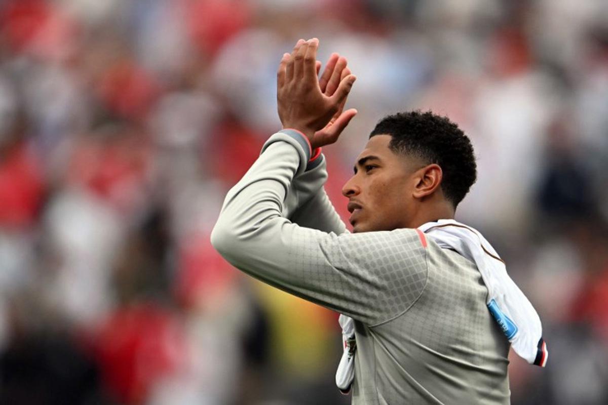 England's midfielder #10 Jude Bellingham greets fans after winning the 2026 World Cup Group L football match between Panama and England at the New York/New Jersey Stadium in East Rutherford on June 27, 2026.   MAURO PIMENTEL / AFP