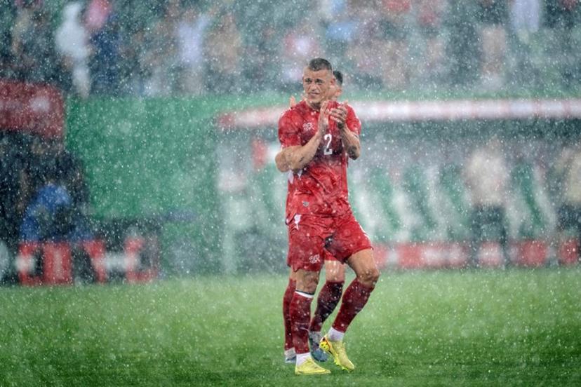 Switzerland's defender #2 Miro Muheim waves goodbye in the rain at the end of a friendly football match between Switzerland and Jordan ahead of the 2026 FIFA World Cup tournament at the Kybunpark in St. Gallen on May 31, 2026.  Ennio LEANZA / AFP