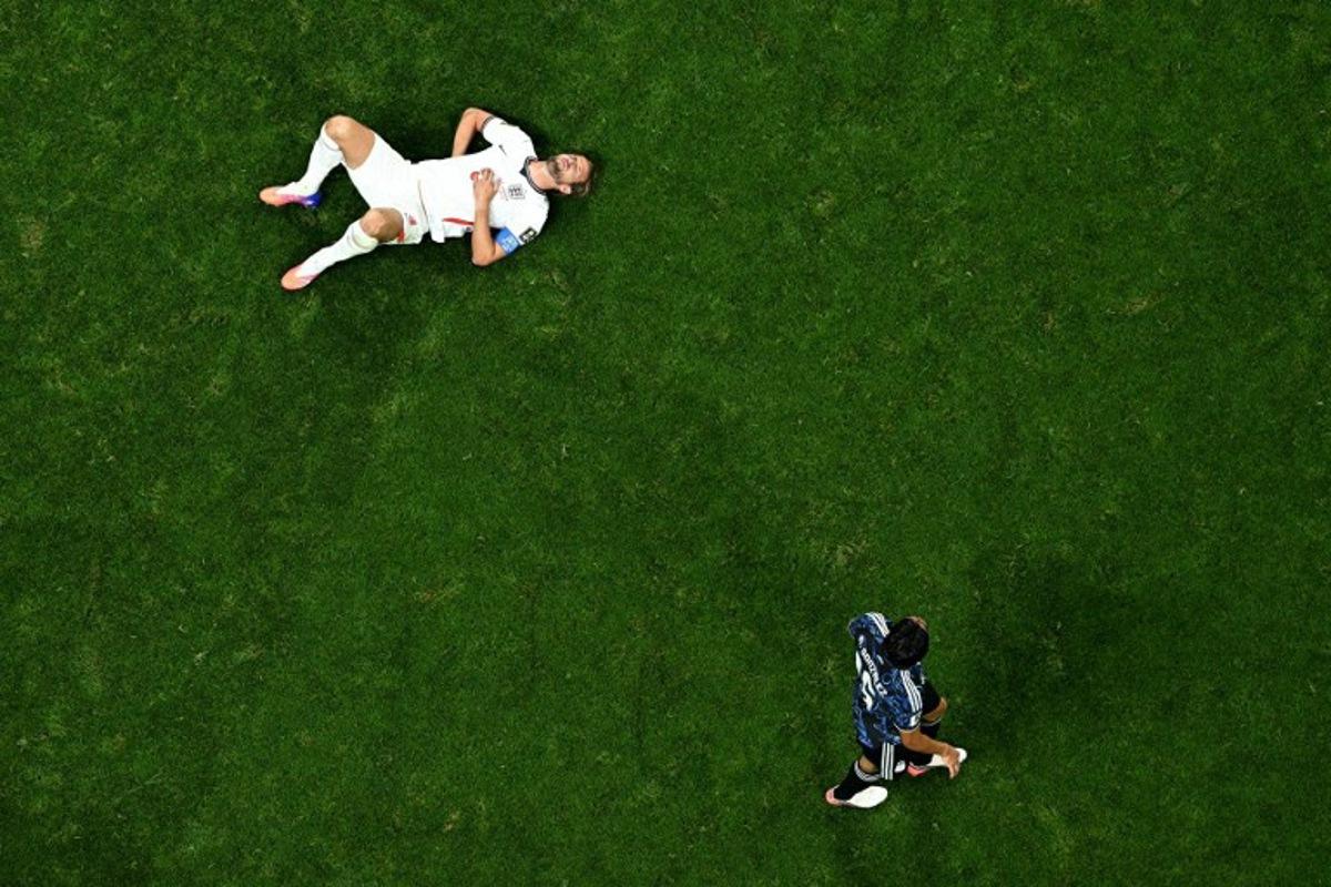 England's forward #09 Harry Kane lies on the pitch during the 2026 World Cup football tournament semi-final match between England and Argentina at the Atlanta Stadium in Atlanta on July 15, 2026.   Jewel SAMAD / AFP