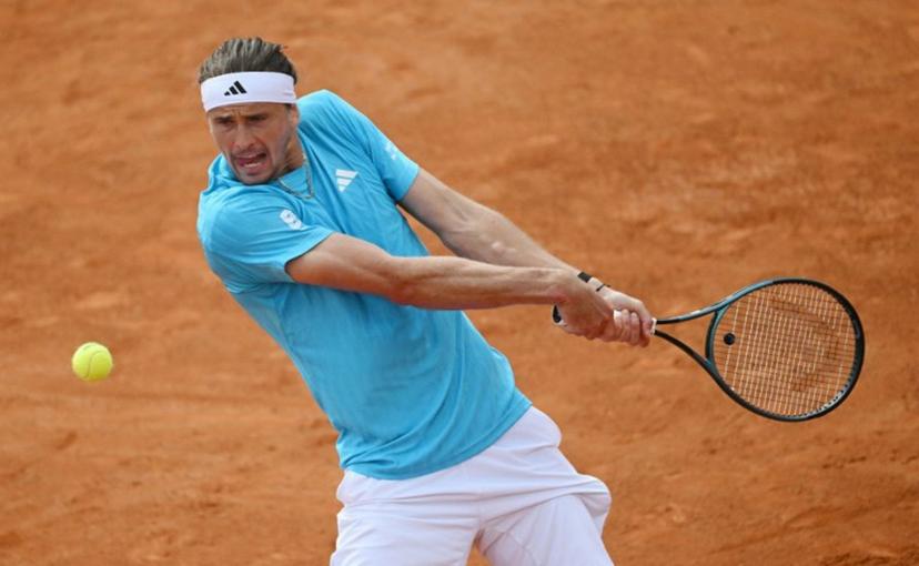 Germany's Alexander Zverev hits a return to Italy's Luciano Darderi during the ATP Rome Open tennis tournament at Foro Italico in Rome on May 12, 2026.   Andreas SOLARO / AFP
