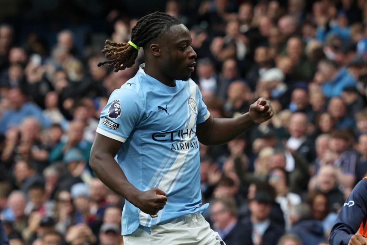 Manchester City's Belgian midfielder #11 Jeremy Doku celebrates after scoring the opening goal during the English Premier League football match between Manchester City and Brentford at the Etihad Stadium in Manchester, north west England, on May 9, 2026.  Darren Staples / AFP