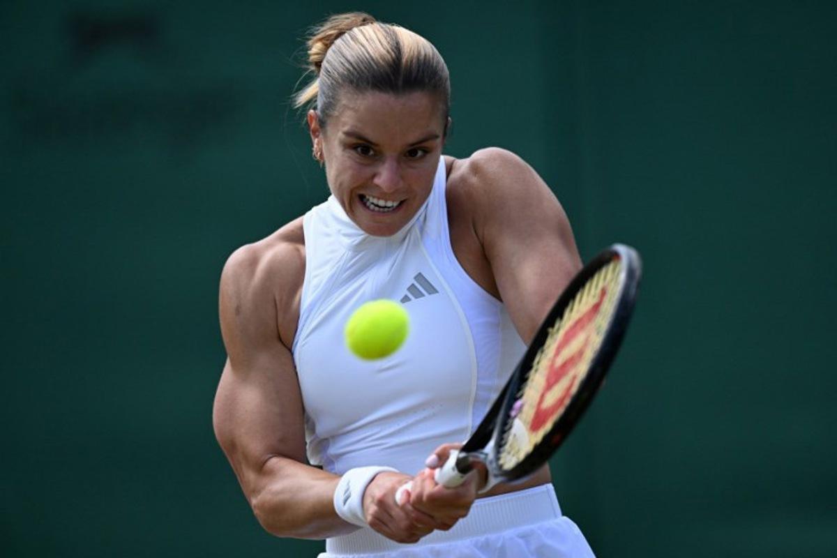 Greece's Maria Sakkari returns against Italy's Jasmine Paolini during their women's singles third round tennis match on the sixth day of the 2026 Wimbledon Championships at The All England Lawn Tennis and Croquet Club in Wimbledon, southwest London, on July 4, 2026.  Kirill KUDRYAVTSEV / AFP
